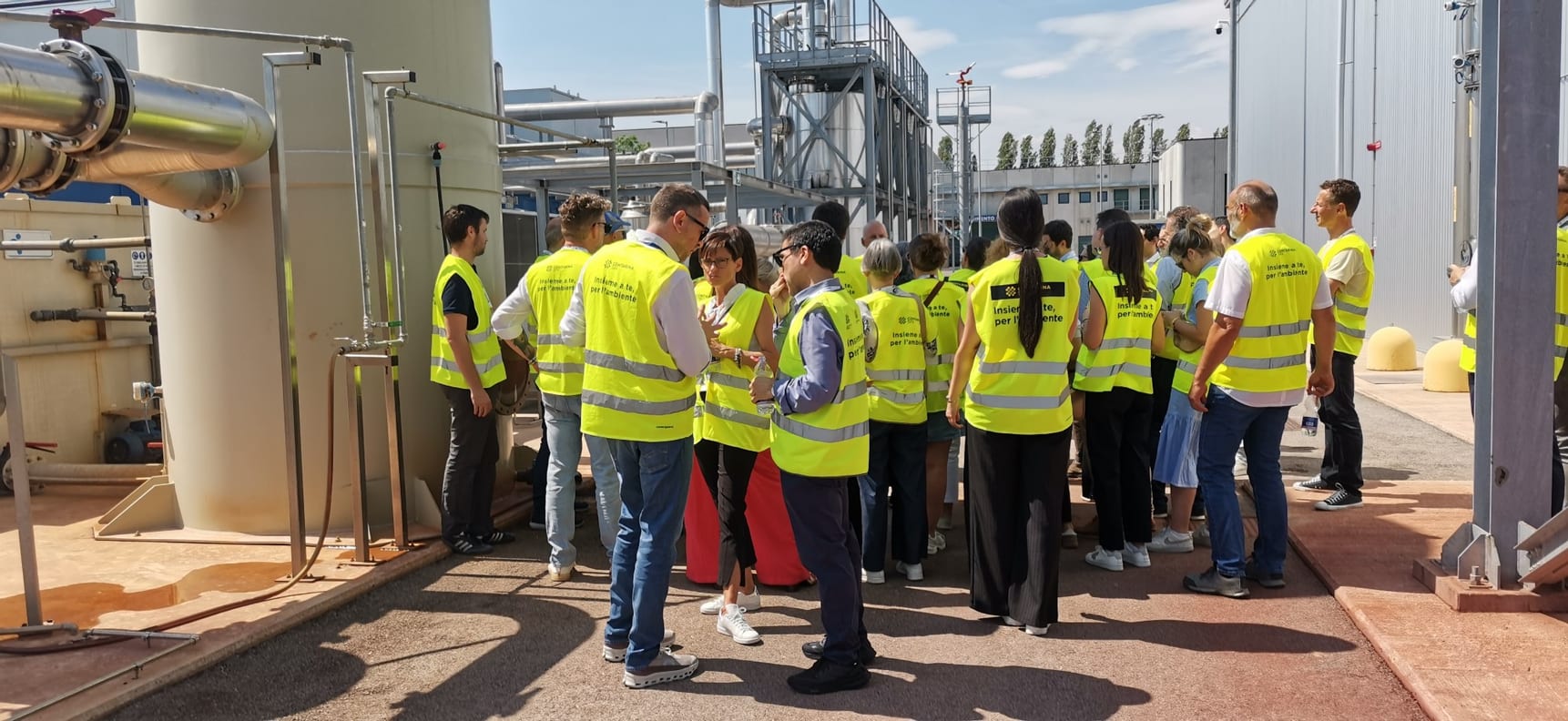 Consortium members in high-visibility vests during the site visit at the Contarina plant in Trevignano