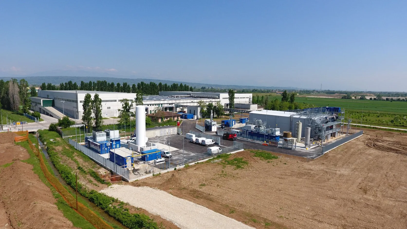 Aerial view of the Contarina biowaste treatment plant in Treviso, Italy, with industrial buildings and process equipment